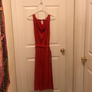 Orange/red scoop neck sleeveless dress.